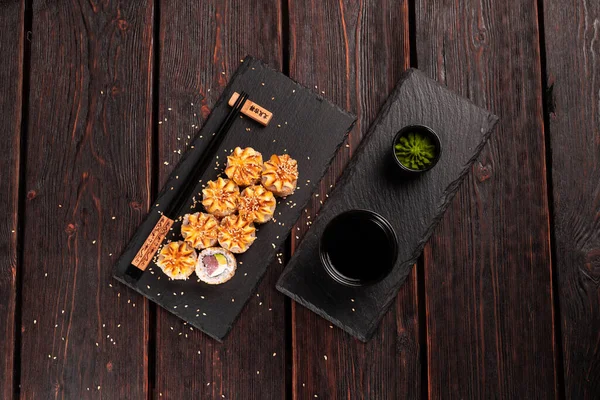 Sushi roll with smoked eel and salmon with cucumber and cheese. Traditional delicious fresh sushi roll set. Sushi menu. Japanese cuisine restaurant. Asian food.