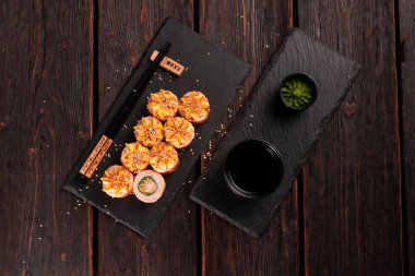 Roll wish fish sushi with chopsticks