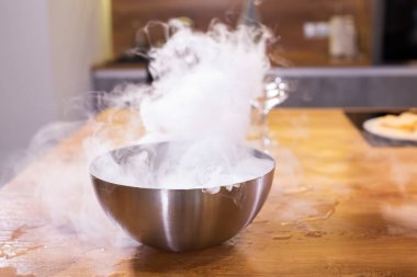 smoke vapor dry ice in bowl in the kitchen