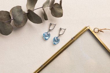 Handmade jewelry on a textile background. Gift for women. Bijouterie and jewellery for a women