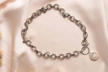 Handmade jewelry on a textile background. Gift for women. Bijouterie and jewellery for a women