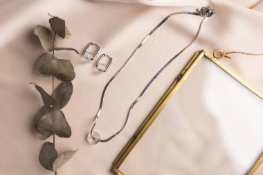 Handmade jewelry on a textile background. Gift for women. Bijouterie and jewellery for a women