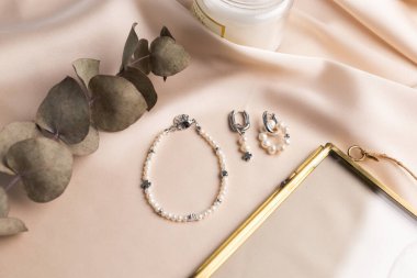 Handmade jewelry on a textile background. Gift for women. Bijouterie and jewellery for a women