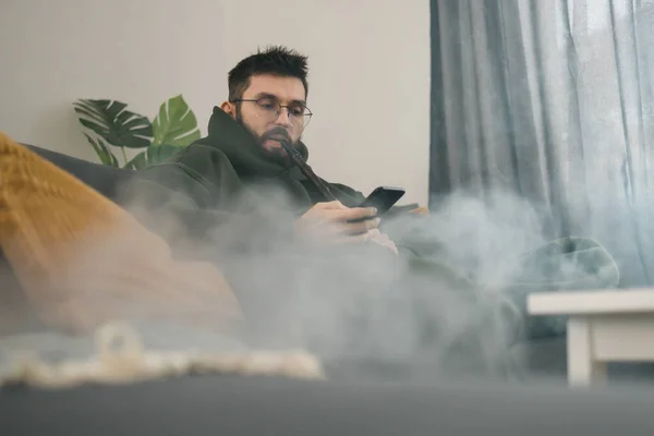 Bearded Millennial Gen Man Smoking Hookah While Relaxing Sofa Home — Stock Photo, Image
