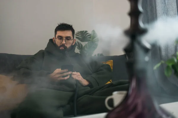 Bearded Millennial Gen Man Smoking Hookah While Relaxing Sofa Home — Stock Photo, Image