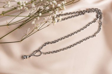 Handmade jewelry on a textile background. Gift for women. Bijouterie and jewellery for a women