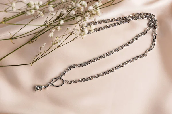 Handmade jewelry on a textile background. Gift for women. Bijouterie and jewellery for a women