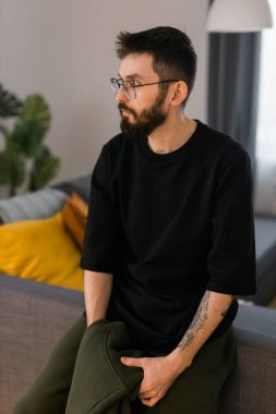 Sad man pondering about his life after a relationship breakup or bipolar disorder - depression asthenia , mental problem and anxiety disorder