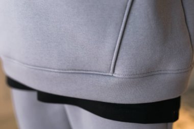 Kapüşonlu kumaş. Kapüşonlu kapüşonlu kapüşonlu, kahverengi tekstil, sıcak kumaş makro arka plan..