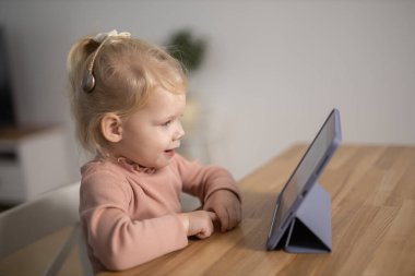 Cochlear implant system. Installation cochlear implant on child girl ear for restores hearing. Kid hears after hear return to normal.