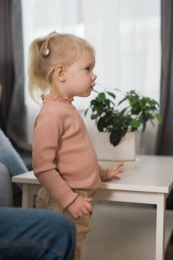 Cochlear implant system. Installation cochlear implant on child girl ear for restores hearing. Kid hears after hear return to normal.