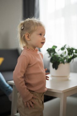 Cochlear implant system. Installation cochlear implant on child girl ear for restores hearing. Kid hears after hear return to normal.