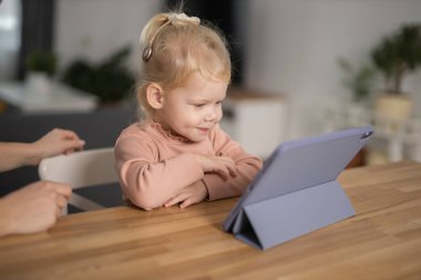 Cochlear implant system. Installation cochlear implant on child girl ear for restores hearing. Kid hears after hear return to normal.