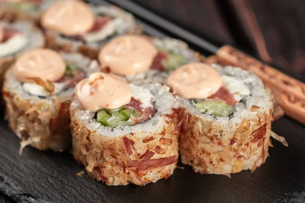 Salmon sushi roll with tuna flakes - sushi asian menu and Japanese food.