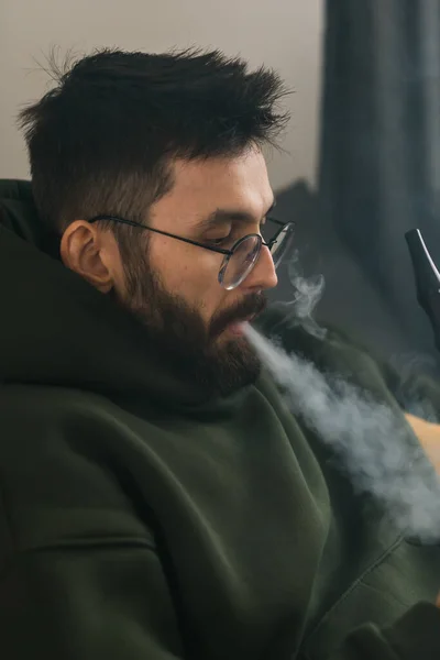 Bearded Man Smoking Hookah Home Blowing Cloud Smoke Chill Time — Stok Foto