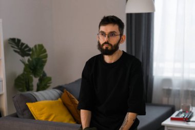 Sad man pondering about his life after a relationship breakup or bipolar disorder - depression asthenia , mental problem and anxiety disorder