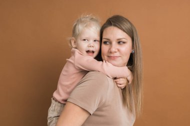 Deaf child girl with cochlear implant studying to hear sounds - recovery after cochlear Implant surgery and rehabilitation
