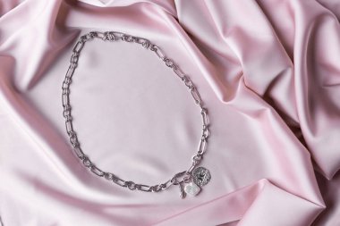 Handmade jewelry on a textile background. Gift for women. Bijouterie and jewellery for women