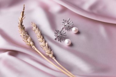 Handmade jewelry on a textile background. Gift for women. Bijouterie and jewellery for women