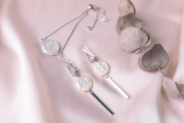 Handmade jewelry on a textile background. Gift for women. Bijouterie and jewellery for women