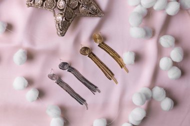 Handmade jewelry on a textile background. Gift for women. Bijouterie and jewellery for women