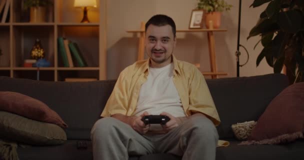 Caucasian Man Playing Video Game Sitting Sofa Living Room Using — Stock video