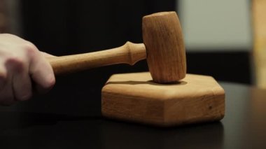 Judges Hand Pronouncing the Sentence and Striking the Daily Hammer. Auction or Guilty Verdict in the Courtroom. Excitement of an Auction as the Lot Sold