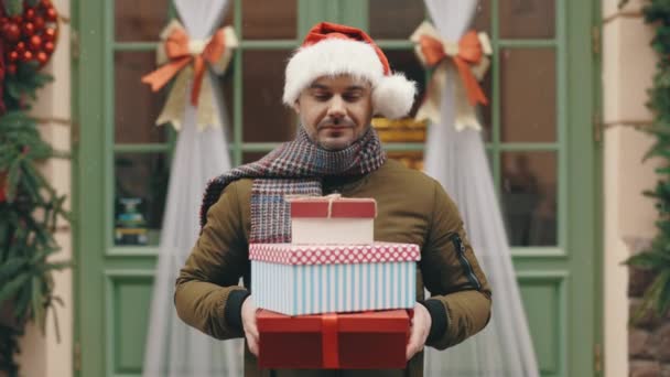 Portrait Positive Guy Wearing Santa Hat Standing Decoration Shop Holding — Stock Video