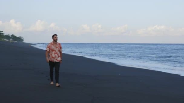 Young Handsome Man Walking Seashore Alone Black Sand Ocean Tourist — Stock Video