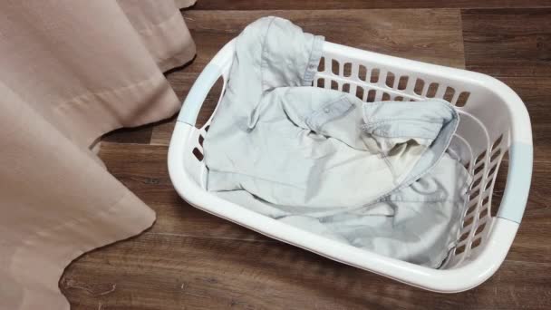One Person Throws Clothes Ironed Plastic Tub Pile Clothes Ironed — Stock Video