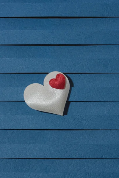 Loving fabric hearts on a blue background, perfect for Valentines Day.