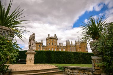 Grantham, Leicestershire, England- 22 August 2023: Outside view of castle, Belvoir Castle is a faux historic castle and stately home in Leicestershire, England, A castle was first built on the site immediately after the Norman Conquest of 1066 clipart