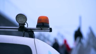 Orange flashing warning light in the city