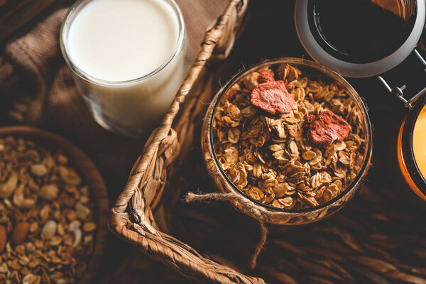 Homemade granola in a wooden bowl in a homely atmosphere.