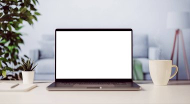 Fotokopi için beyaz ekranı olan modern bir laptop, bir fincan sıcak kahveyle rahat bir ev ışığı.