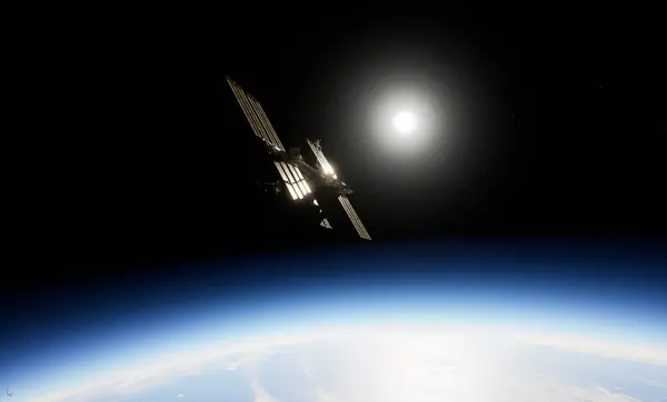 Uluslararası Uzay İstasyonu, Dünya 'nın atmosferine ve uzayına karşı siluetlendi. Arka planda güneş panelleri görünür ve parlak güneş ışığı vardı.. 