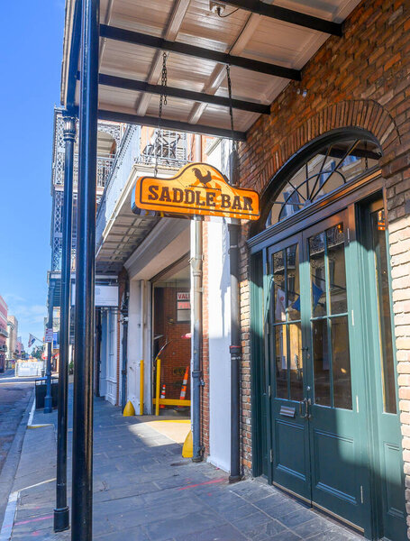 NEW ORLEANS, LA, USA - DECEMBER 23, 2023: Angled front view of the Saddle Bar, a country bar on Bienville Street in the French Quarter