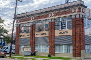 NEW ORLEANS, LA, USA - FEBRUARY 15, 2024: Front of the Carrollton Avenue Baptist Church in an old (20th century) industrial building clipart