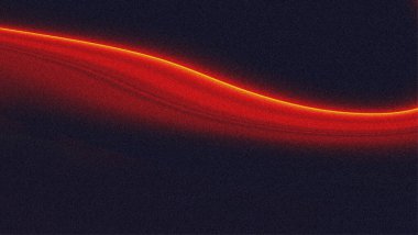 Kum taneli dokuya sahip soyut koyu kırmızı eğim. Gradyan arkaplanda turuncu neon ışığı.