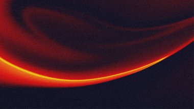 Kum taneli dokuya sahip soyut koyu kırmızı eğim. Gradyan arkaplanda turuncu neon ışığı.