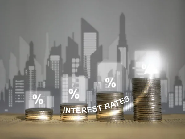 stock image Rising Interest: Coin Stacks on Bank Book with Upward Arrow Signifying Finance, Mortgage Interest Rates, and Percentage Growth, Reflecting an Improving Economy