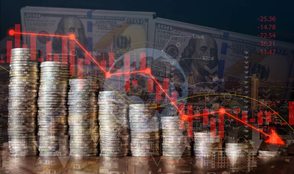 Recession and crisis concept: Stacks of coins and red downward arrow symbolize the decline of the global economy, markets, and wealth