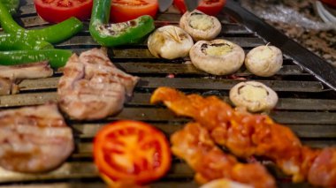 Closeup of shish meat with vegetables 