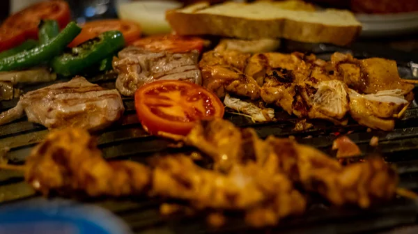 Closeup of shish meat with vegetables 