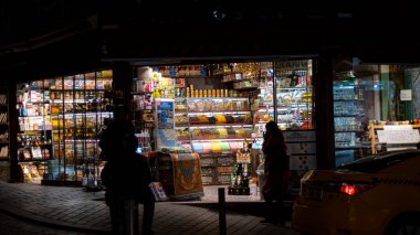 shopping mall, people and food concept-happy woman with bags at night market