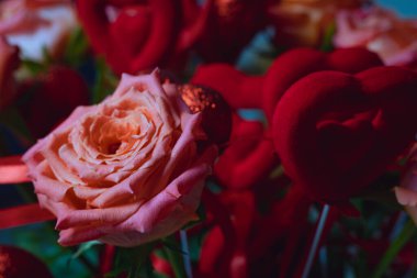 red roses with red hearts, a bouquet of roses with hearts for Valentine's Day, a bouquet of roses for March 8