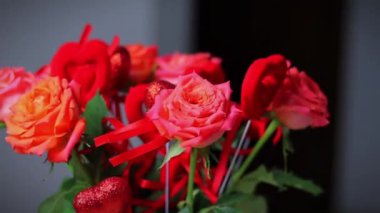 ed roses with red hearts, a bouquet of roses with hearts for Valentine's Day, a bouquet of roses for March 8
