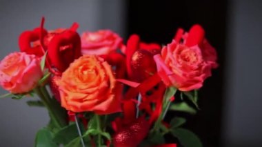 ed roses with red hearts, a bouquet of roses with hearts for Valentine's Day, a bouquet of roses for March 8