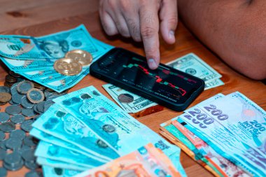 business man holding a coin cost support and saving money financial service concept and saving