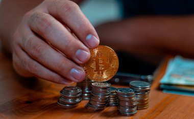 business man holding a coin cost support and saving money financial service concept and saving